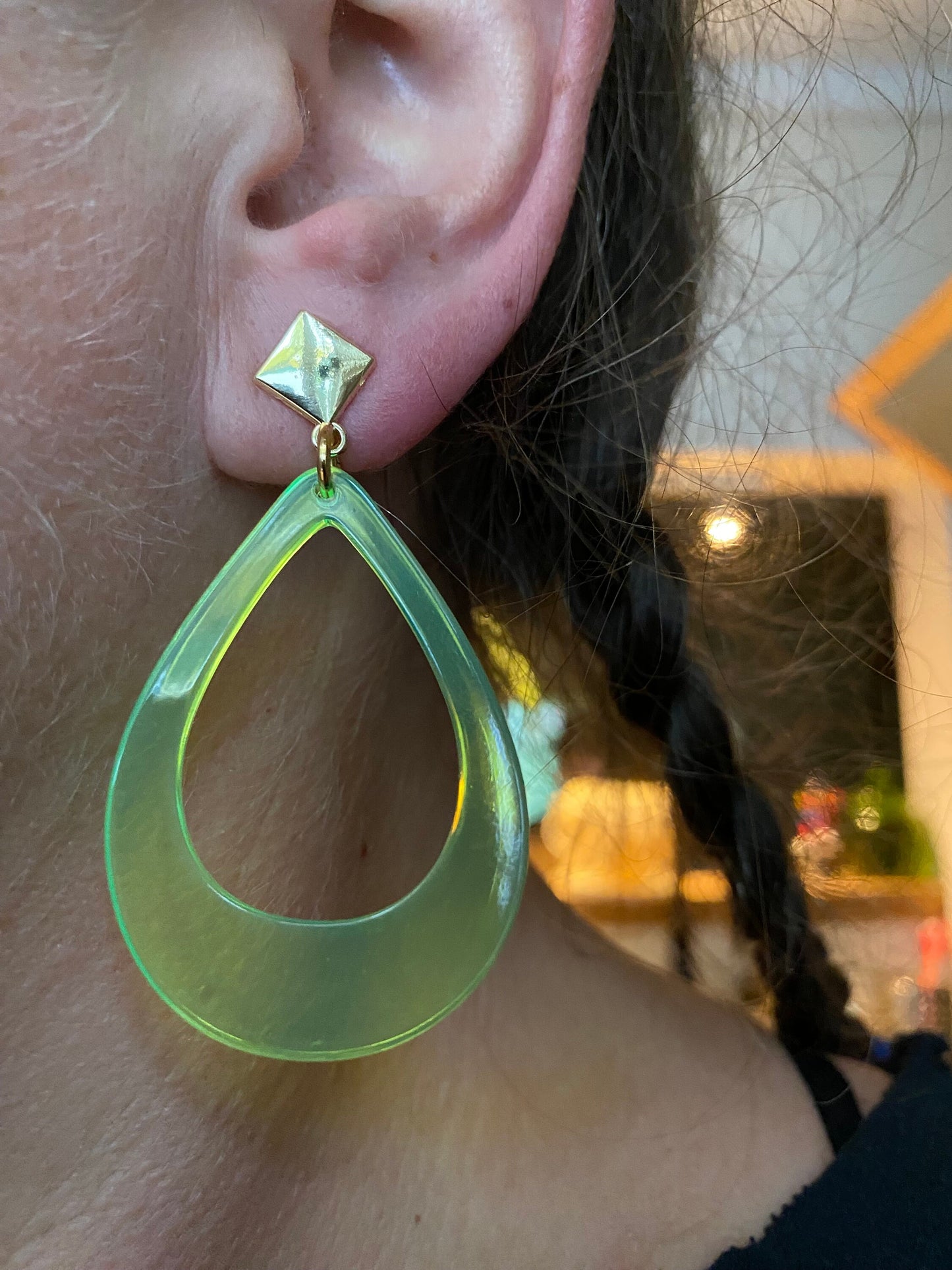 Vibrant retro neon dangling clip on hoop earrings in a teardrop shape with hinged screwback closures