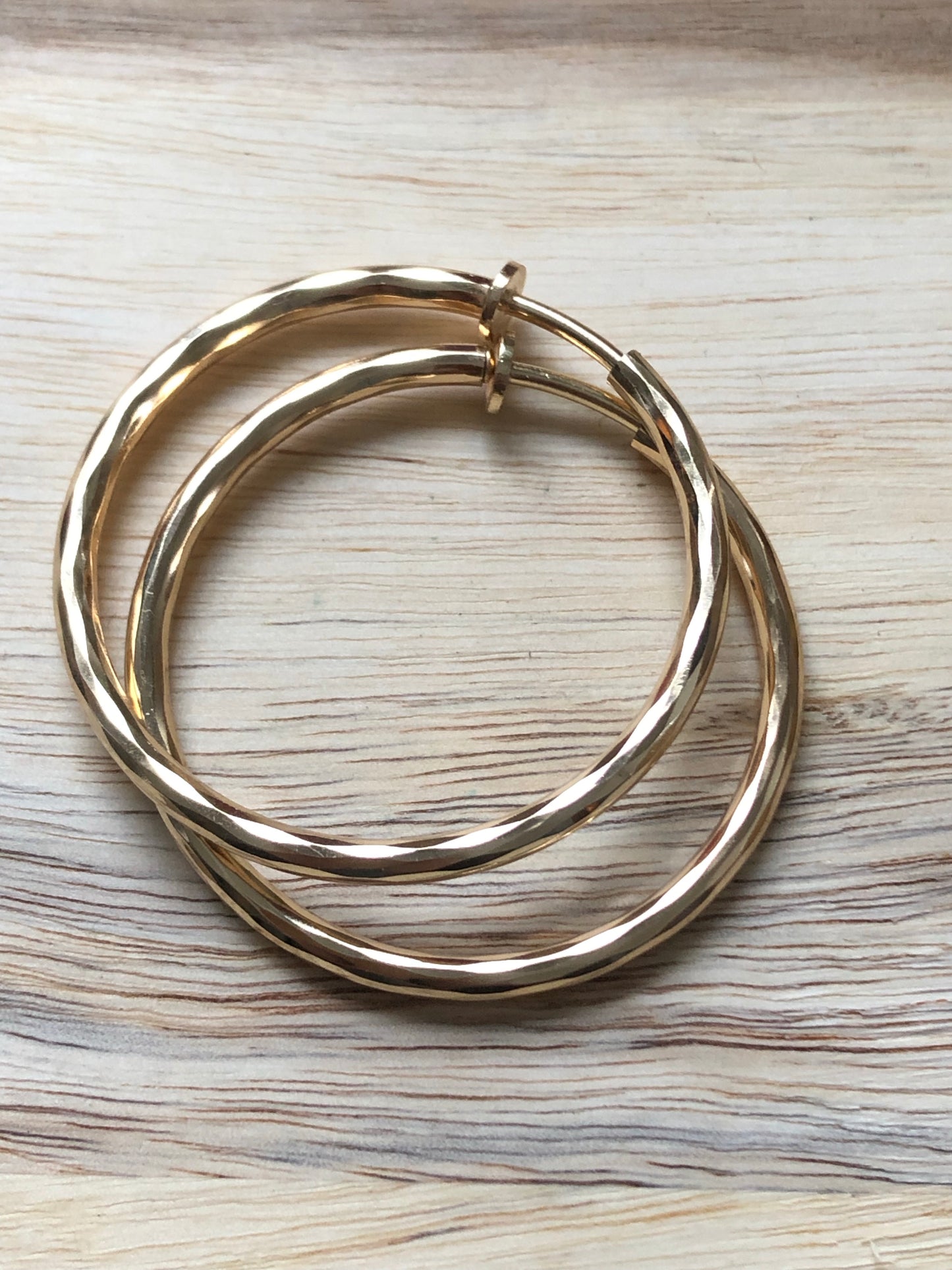 Golden spring hoop clip on earrings