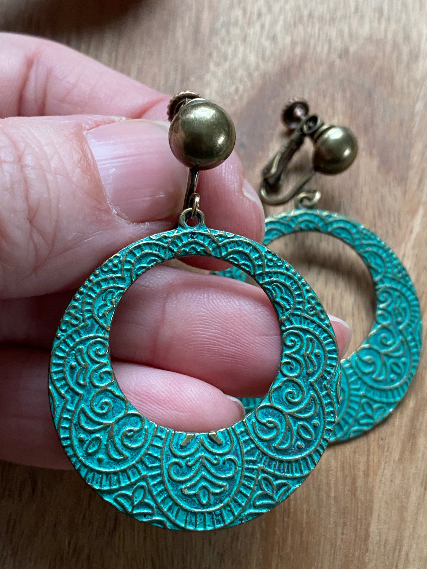 Dangling turquoise patina hoops with bronze hinged screwback closures