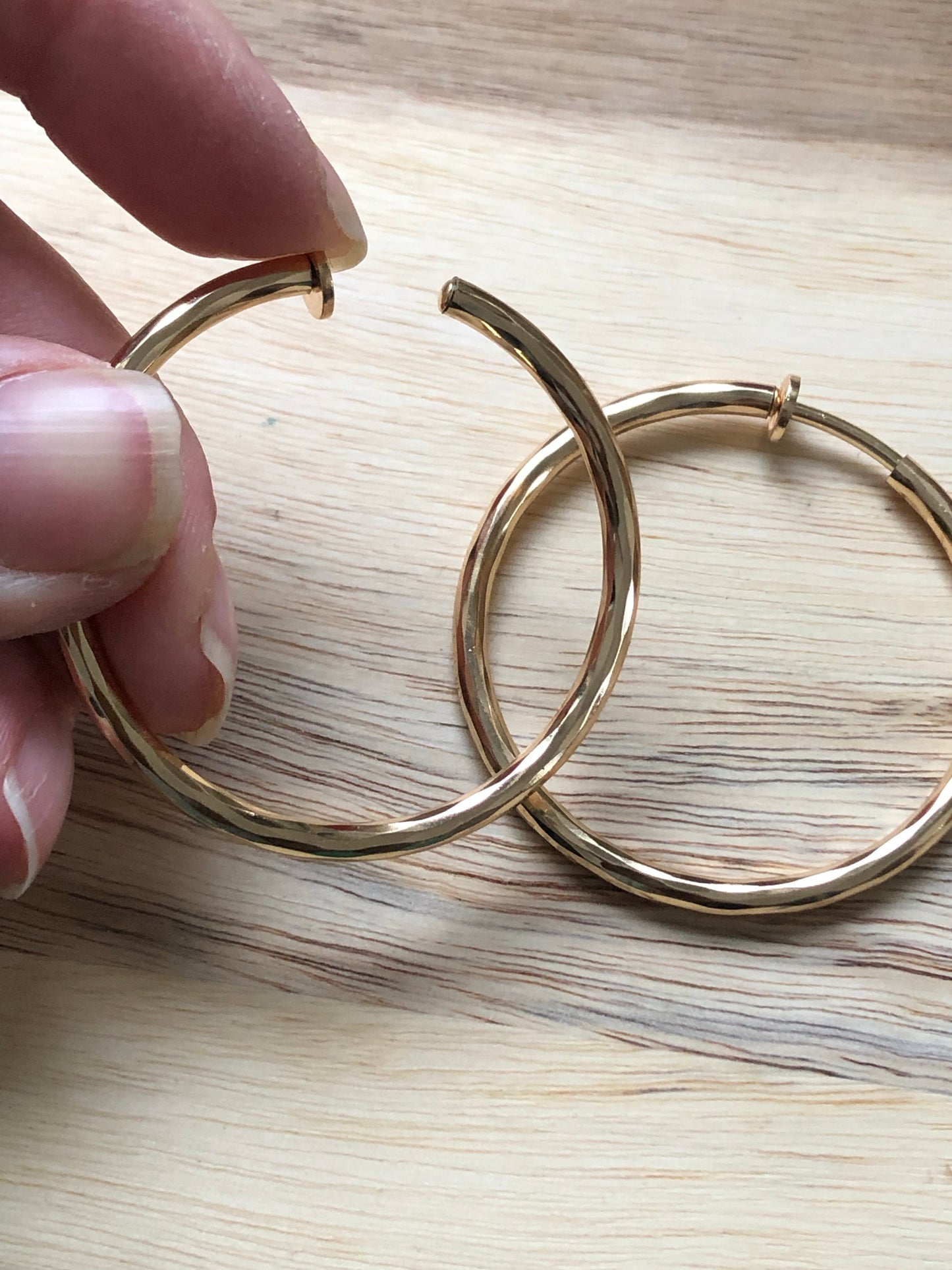 Golden spring hoop clip on earrings