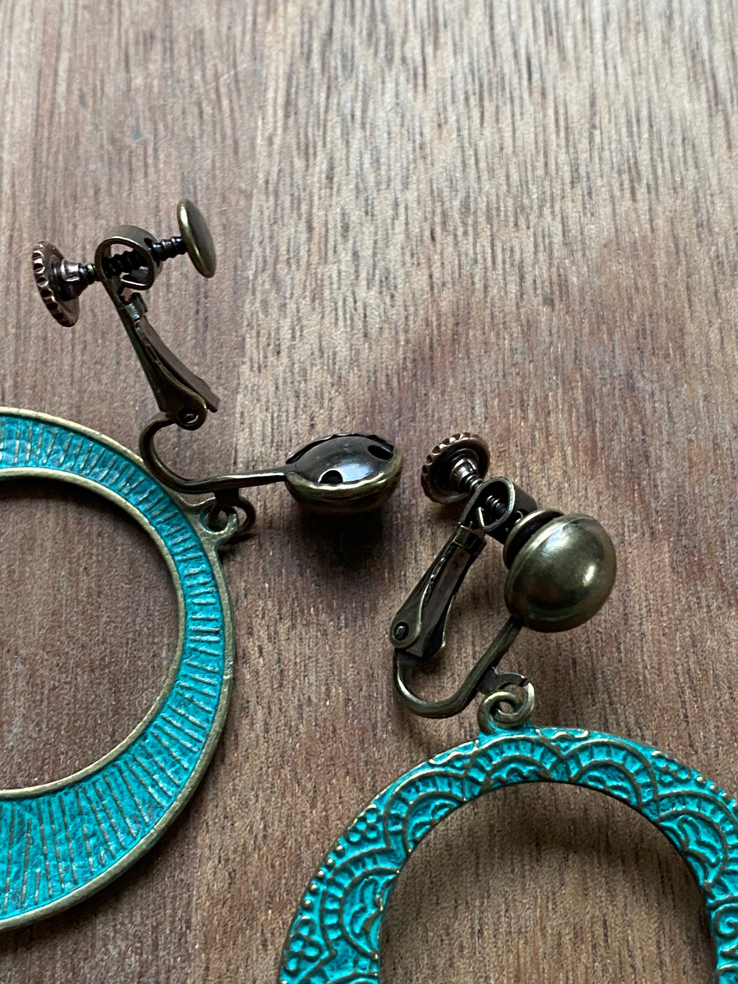 Dangling turquoise patina hoops with bronze hinged screwback closures